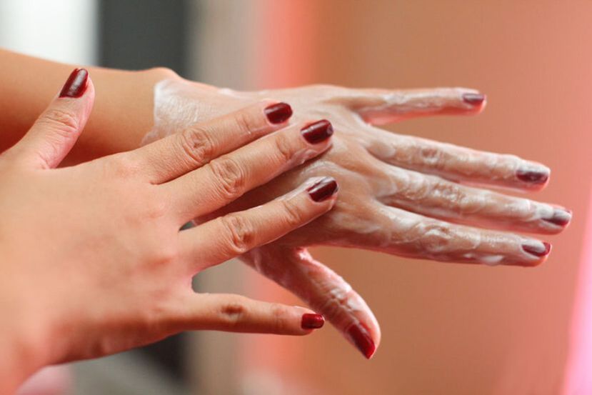 apply cream to hands for skin rejuvenation
